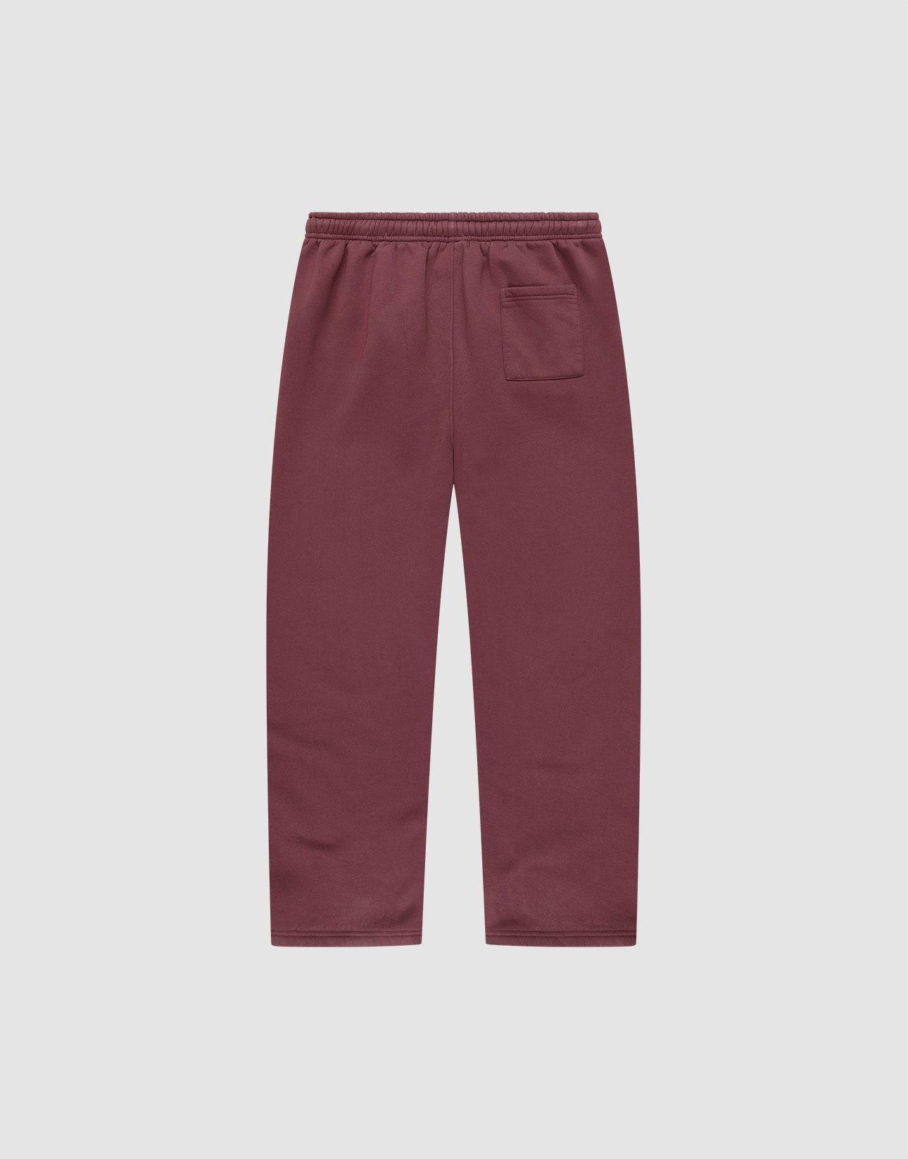 The LIVE FAST DIE YOUNG Basic Wide Jogger features a wide fit, straight-leg design in maroon, made from soft Baumwolle with an elastic waistband and single back pocket, shown laid flat on a plain white background.