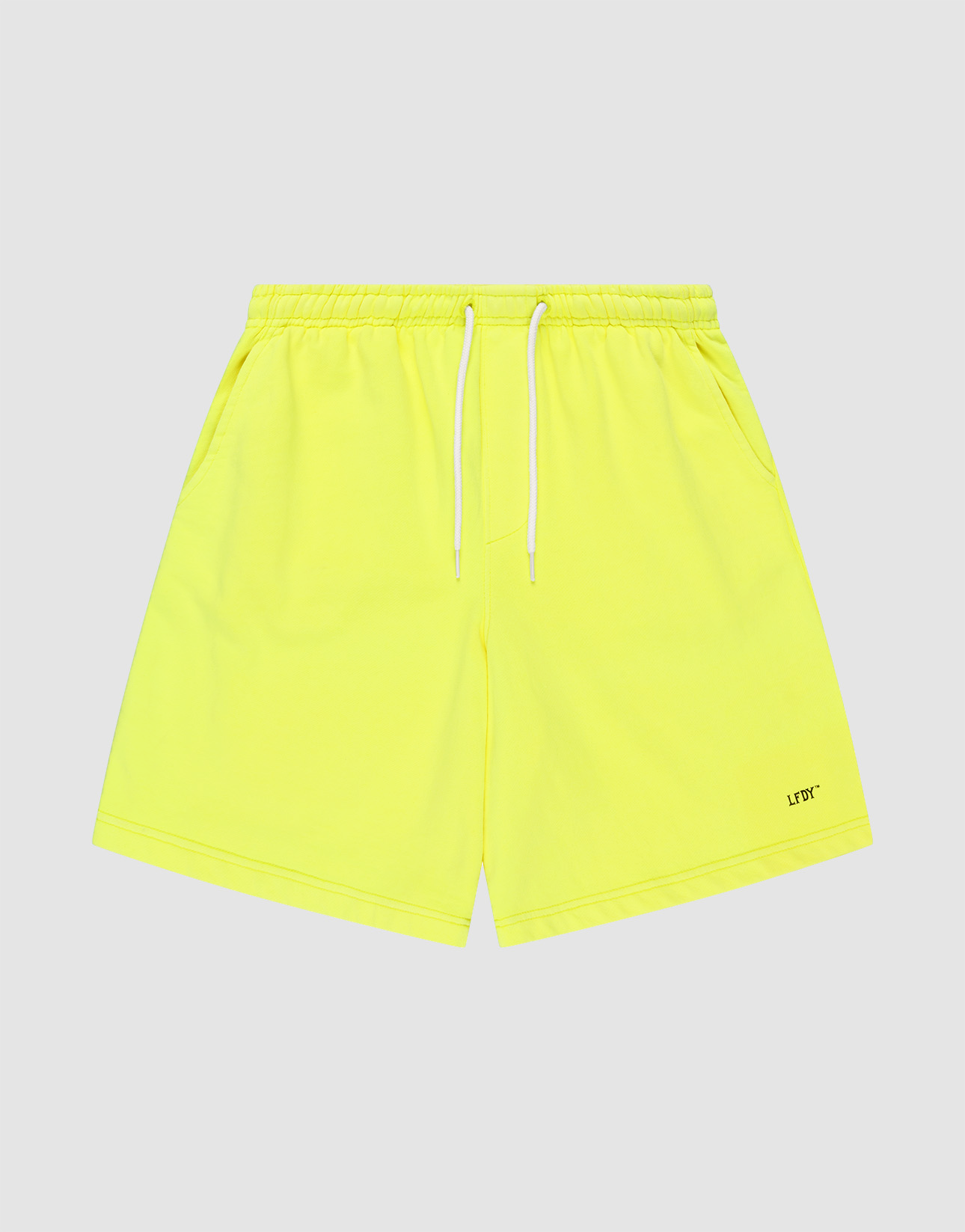 Basic Shorts by LIVE FAST DIE YOUNG in neon yellow, feature an elastischer Bund, white drawstring, side pockets, regular fit, and a small LFTD logo-print near the hem. Displayed on a light grey background. | plain