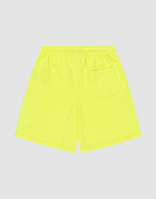 The LIVE FAST DIE YOUNG Basic Shorts are bright yellow with a regular fit, an elastic waistband, and a single back right patch pocket, shown flat on a plain light gray background.