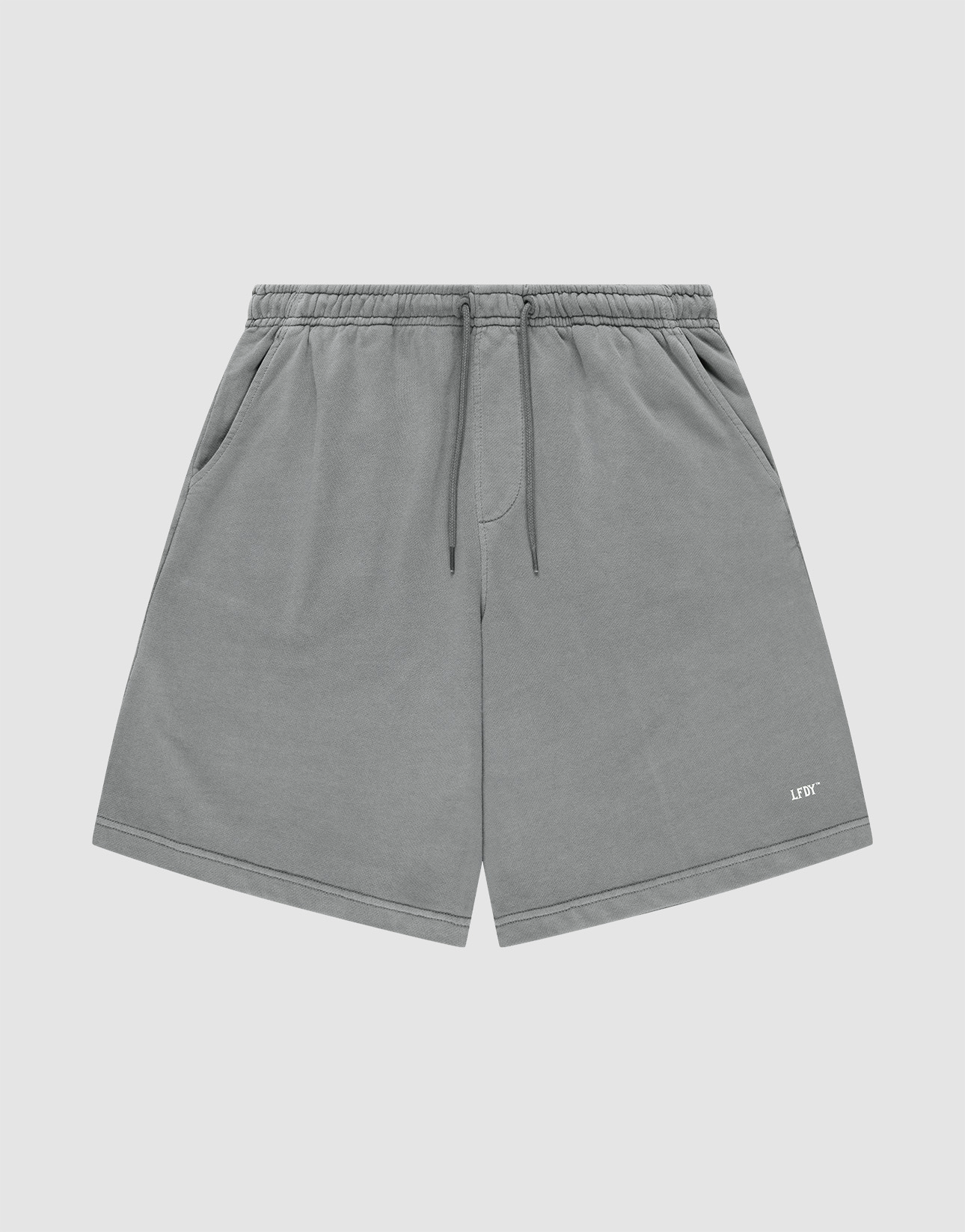 LIVE FAST DIE YOUNG Basic Shorts in gray with a faded finish feature an elastic waistband, side pockets, and a small white LIFY logo on the lower left leg, shown against a plain light background. | plain