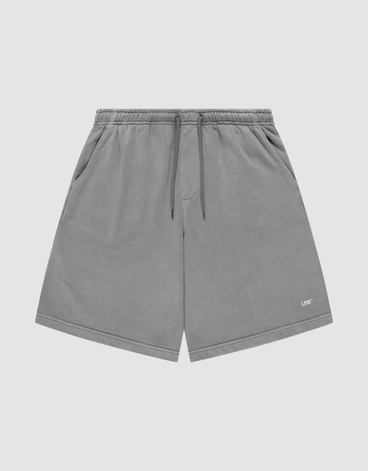 LIVE FAST DIE YOUNG Basic Shorts in gray with a faded finish feature an elastic waistband, side pockets, and a small white LIFY logo on the lower left leg, shown against a plain light background. | plain