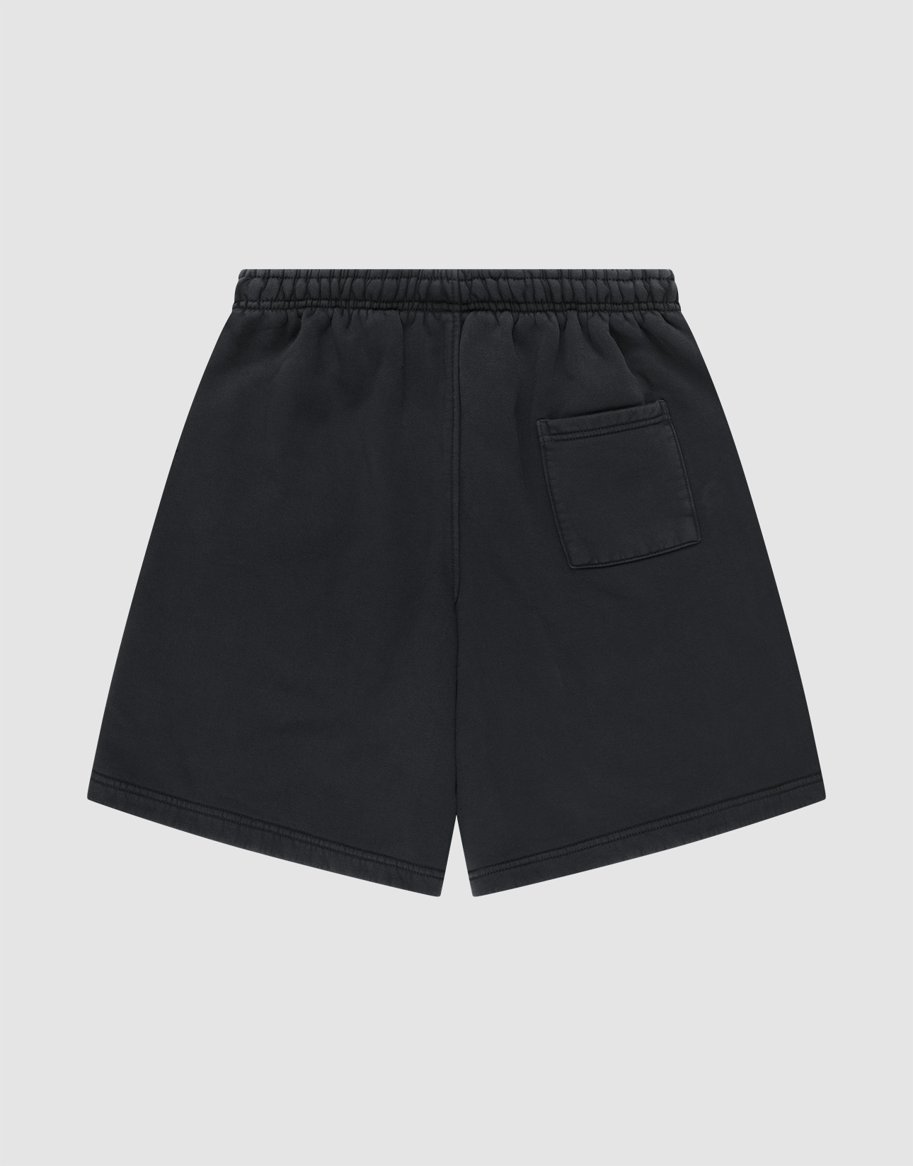 LIVE FAST DIE YOUNG Basic Shorts in black, featuring an elastic waistband and a small patch pocket on the back right. Displayed flat on a light gray background. Regular Fit design for everyday comfort.