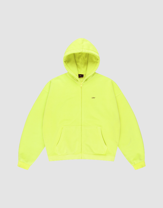 The Basic Hooded Zip by LIVE FAST DIE YOUNG is a bright yellow, oversized zip-up hoodie with a hood, front pockets, and subtle branding on the left chest, shown against a light gray background. | plain