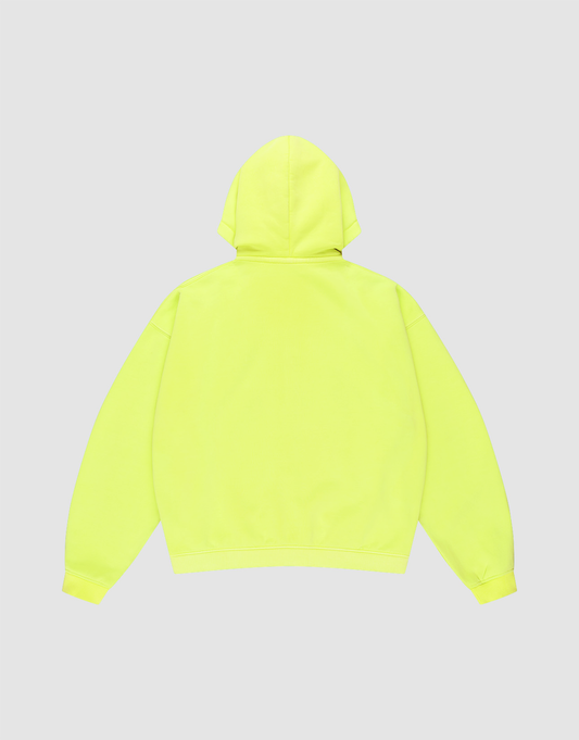 The LIVE FAST DIE YOUNG Basic Hooded Zip in bright yellow is shown from the back on a light gray background, featuring an oversize fit, long sleeves, ribbed cuffs and hem, and bold brand detailing.