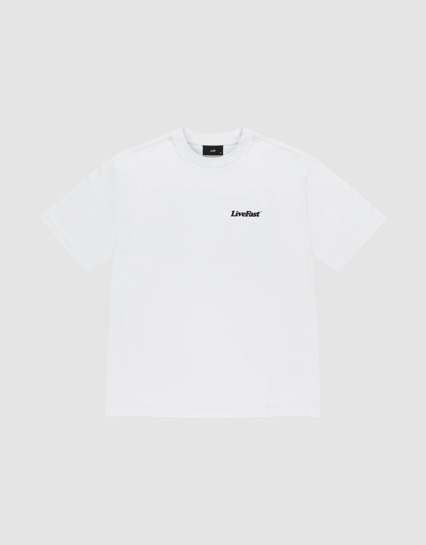 The Basic 280 Tee by LIVE FAST DIE YOUNG is an oversize white short-sleeve t-shirt made of 100% Baumwolle, with a small black LiveFast logo on the left chest, shown against a light gray background.
