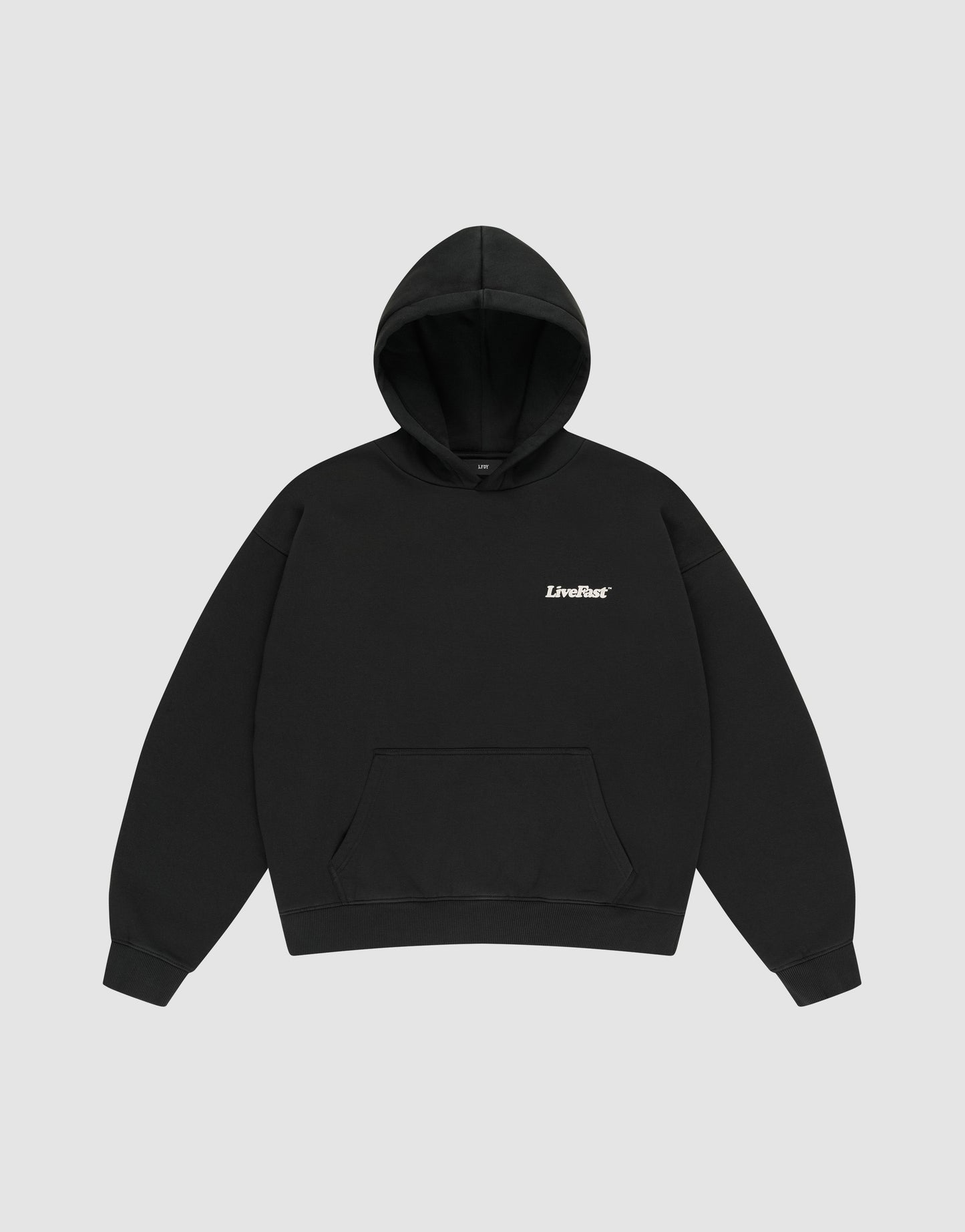 The Basic 360 Hooded by LIVE FAST DIE YOUNG is a plain black oversize fit sweatshirt made of soft cotton, featuring a front pocket and "LiveFast" in small white text on the left chest, shown on a light gray background.