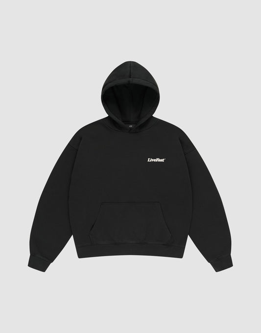 The Basic 360 Hooded by LIVE FAST DIE YOUNG is a plain black oversize fit sweatshirt made of soft cotton, featuring a front pocket and "LiveFast" in small white text on the left chest, shown on a light gray background.