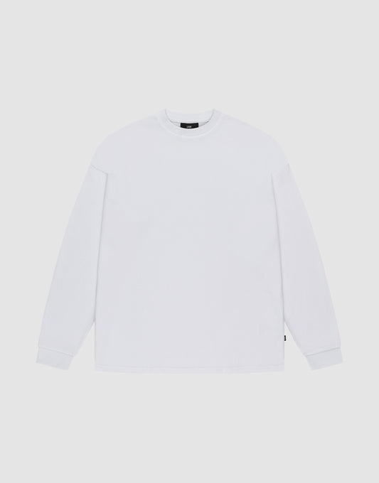 The LIVE FAST DIE YOUNG Blank Waffle Longsleeve, in Oversize Fit, is a plain white crew neck shirt with simple ribbed cuffs, made from 100% Baumwolle and featuring a minimal design without visible logos or patterns. | plain
