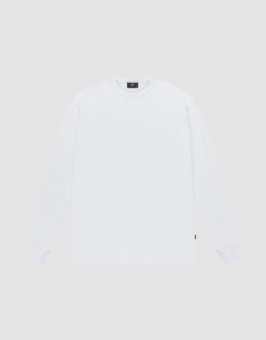 The LIVE FAST DIE YOUNG Blank Waffle Longsleeve is a white, oversized, crewneck shirt made from 100% Baumwolle. Laid flat on a light gray background, it features a small black flag-label on the lower side seam and no visible logos or designs. | plain