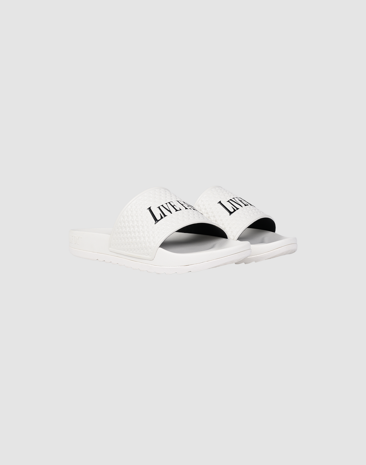A pair of white LFDY Slides by LIVE FAST DIE YOUNG featuring a textured PU strap with "LIVERPOOL" printed in black, shown on a plain light gray background.