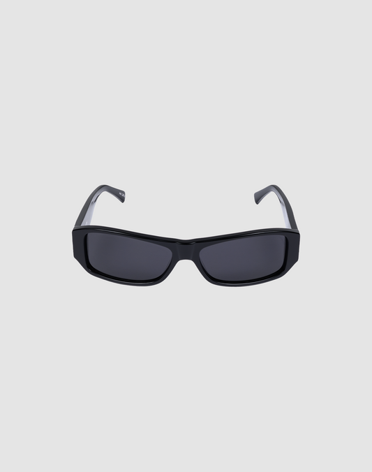 The LFDY Wrap by LIVE FAST DIE YOUNG are rectangular black sunglasses with thick frames and dark lenses offering UV protection, shown on a plain light gray background.