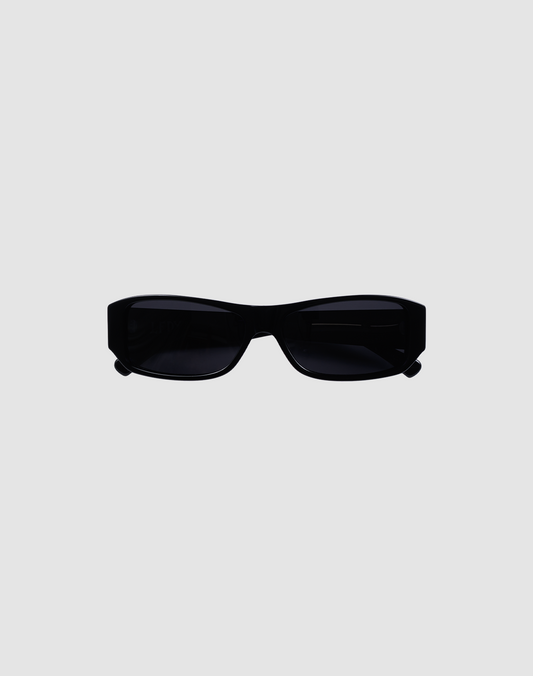 The LFDY Wrap by LIVE FAST DIE YOUNG is a pair of rectangular black sunglasses with dark lenses and UV-Schutz, displayed on a plain light gray background.