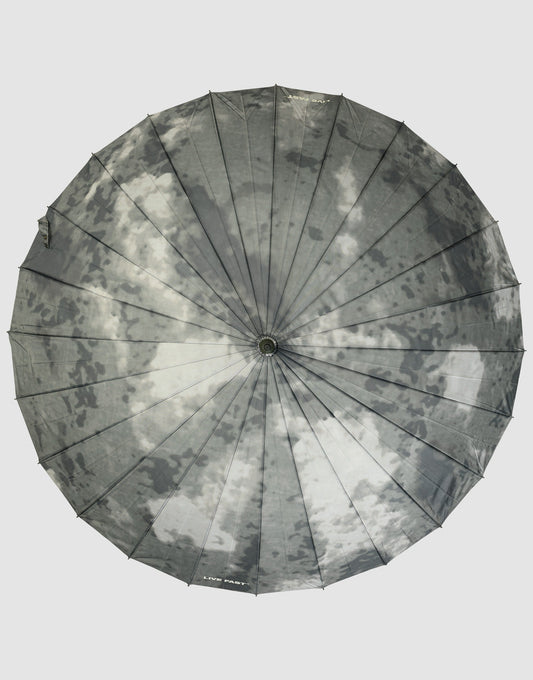 The LFDY Umbrella by LIVE FAST DIE YOUNG features a round, moon-inspired printed design with craters and gray shades, supported by a durable frame for lasting use.