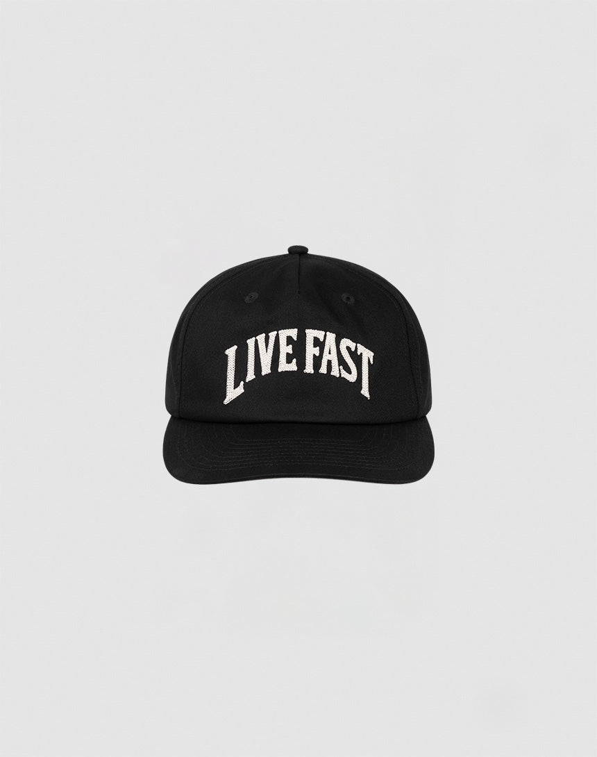 The Live Fast Unstructured Cap by LIVE FAST DIE YOUNG is a black baseball cap featuring a Flag Label and bold white LIVE FAST Logo-Stick embroidery on the front, shown against a plain light gray background.| plain