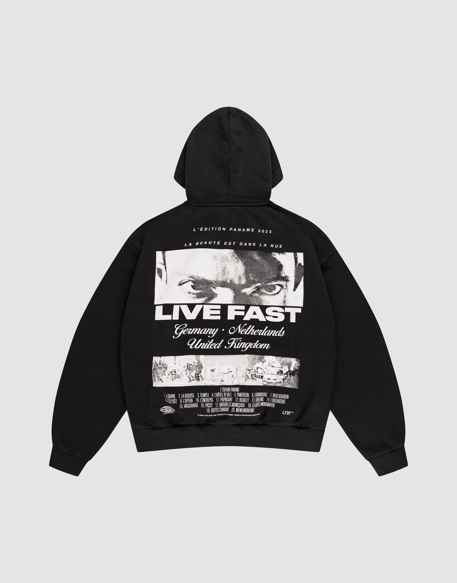 The LFDY Cinema Hooded by LIVE FAST DIE YOUNG is an oversized black cotton hoodie with intense eyes and "LIVE FAST" printed on the front, plus Germany, Netherlands, United Kingdom text and a cityscape image on the back. | plain
