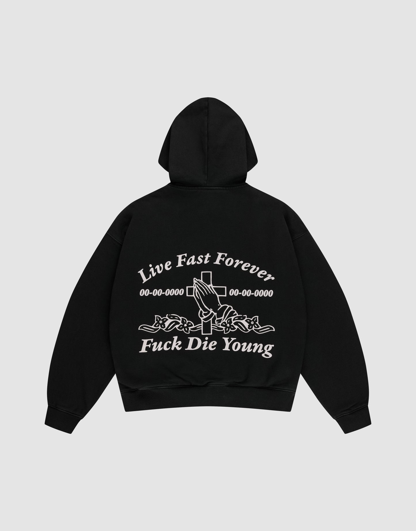 The LFDY Praying Hooded Zip by LIVE FAST DIE YOUNG is a black oversized hoodie with bold white “Live Fast Forever and Fuck Die Young” text, cross, numbers, and rose-holding hands graphic on the back, plus a subtle distress effect.