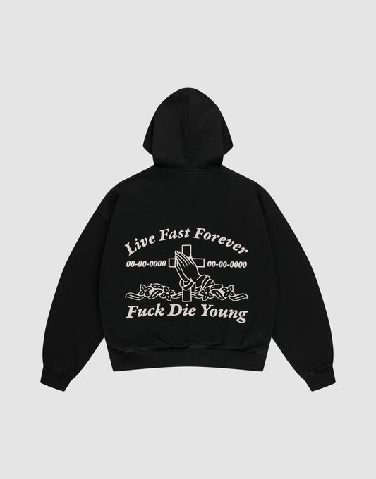 The LFDY Praying Hooded Zip by LIVE FAST DIE YOUNG is a black oversized hoodie with bold white “Live Fast Forever and Fuck Die Young” text, cross, numbers, and rose-holding hands graphic on the back, plus a subtle distress effect. | plain