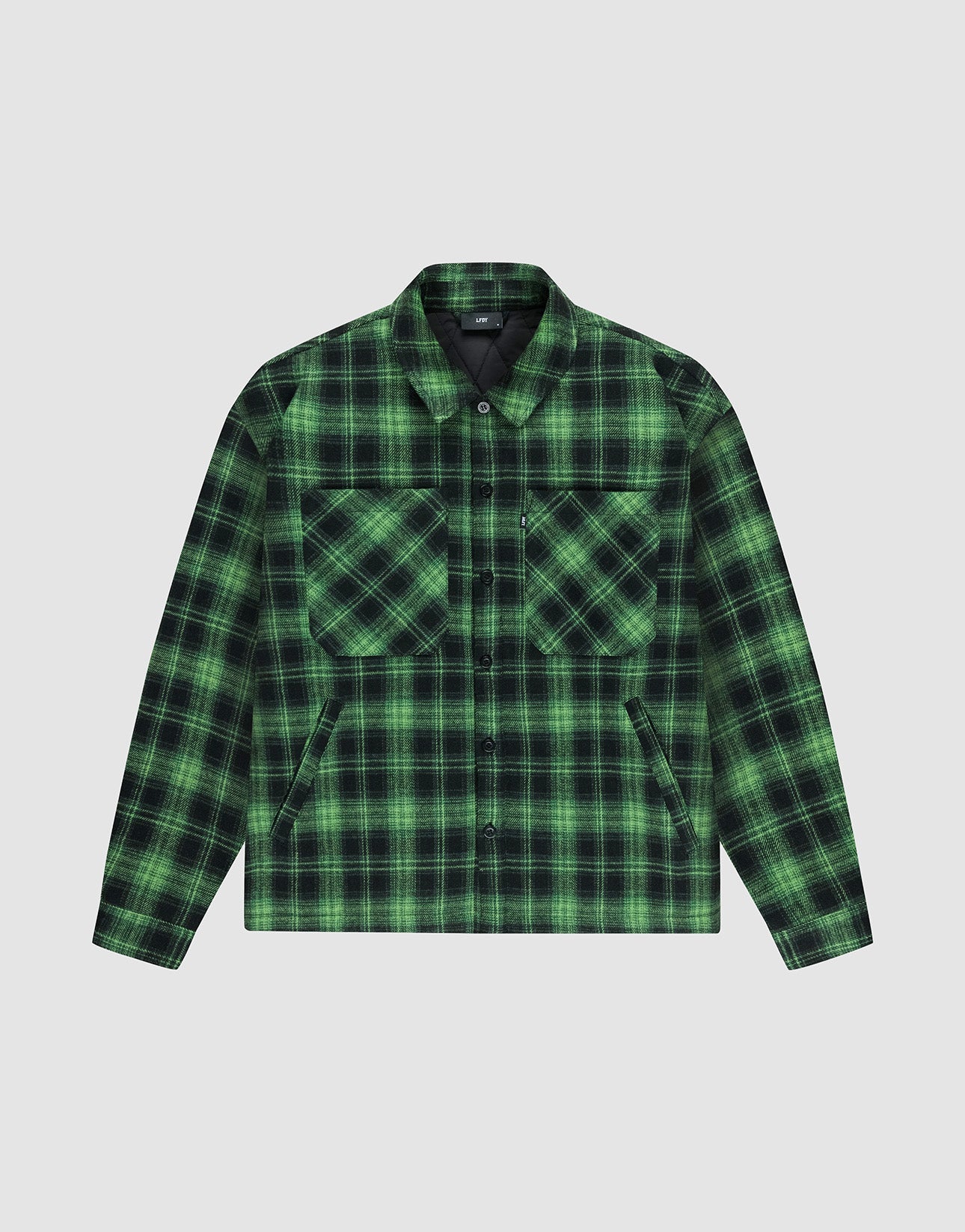 The LIVE FAST DIE YOUNG LFDY Padded Flannel features a green and black plaid oversize fit with two large chest pockets and a collar, shown against a plain light gray background. | plain