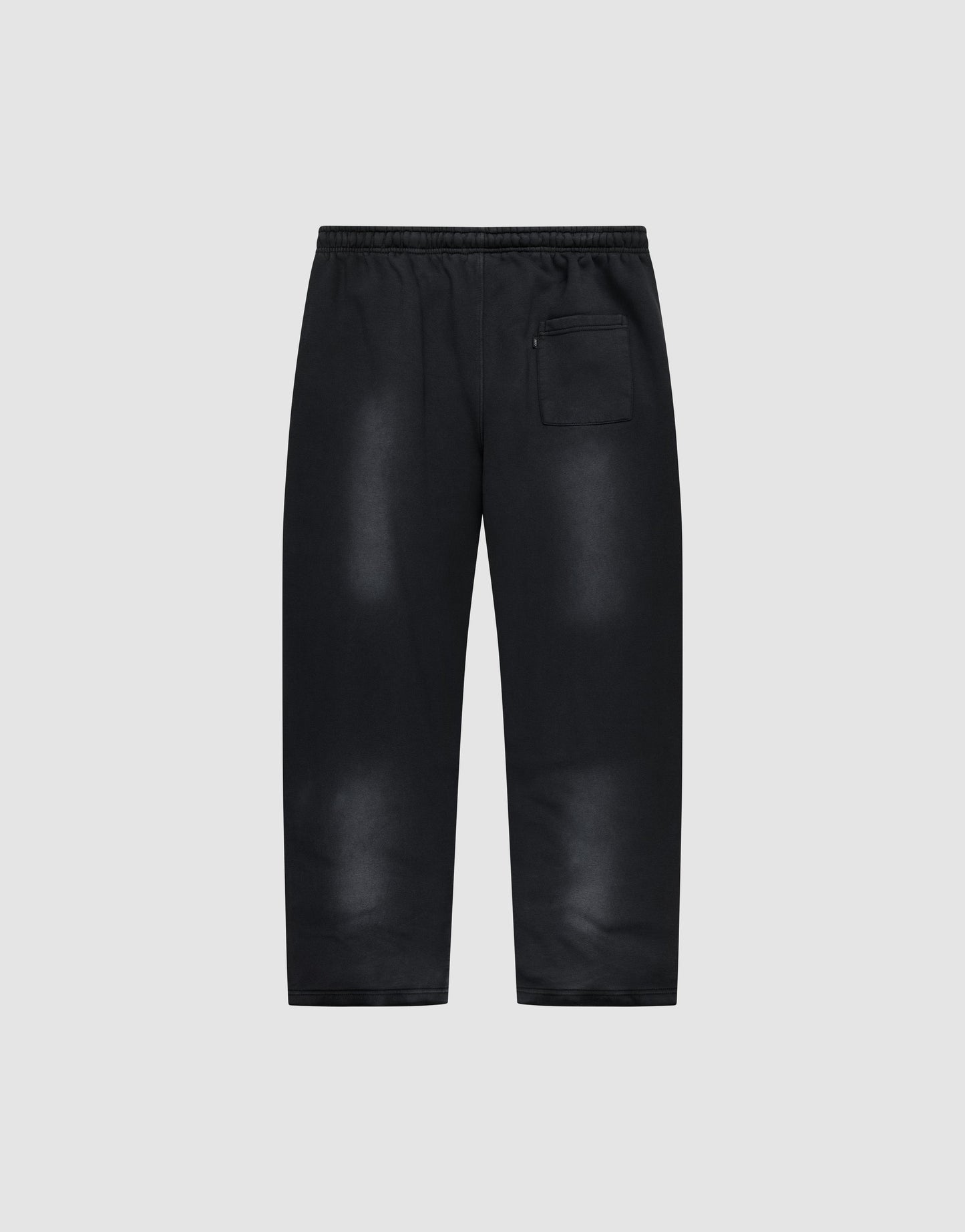 The Live Fast Rhinestone Jogger by LIVE FAST DIE YOUNG features a black wide fit, elastic waistband, spray effect faded areas, relaxed silhouette, and a single zippered back pocket. Shown against a plain light gray background.