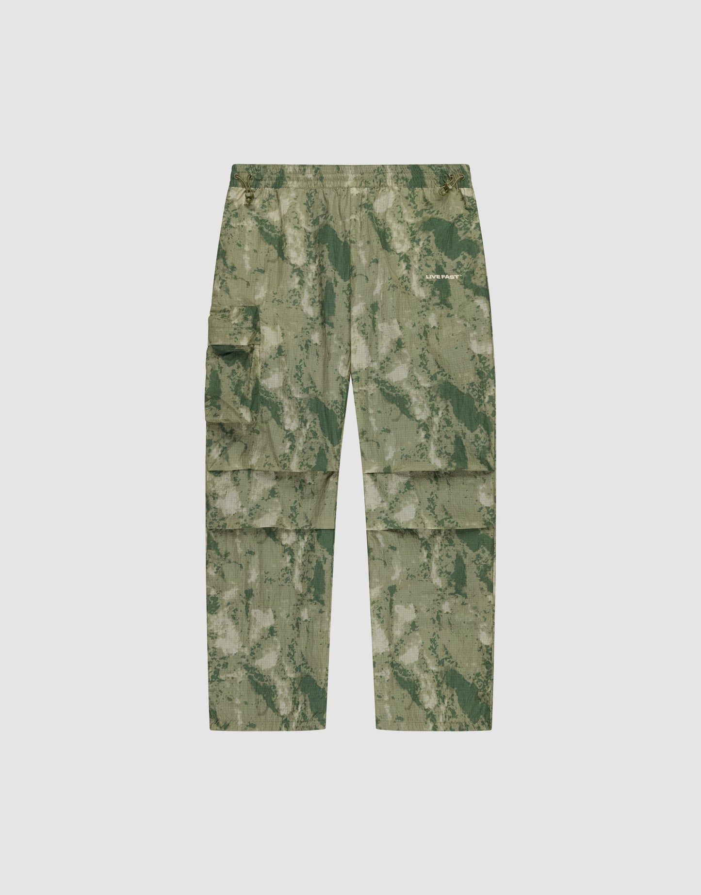 LIVE FAST DIE YOUNG Live Fast Nylon Pants in green camouflage, featuring an oversize fit, multiple cargo pockets, elastic waistband, and zipper, shown flat on a plain light background.