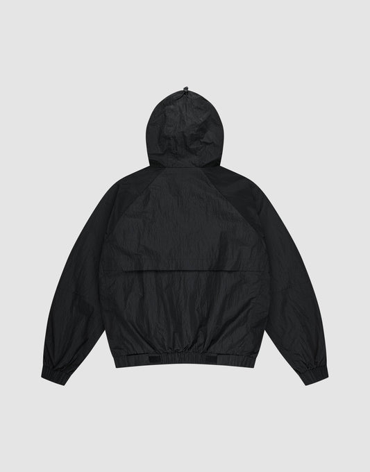 The Live Fast Nylon Jacket by LIVE FAST DIE YOUNG is shown flat from the back, featuring an oversized fit, long sleeves, elastic cuffs, and waistband, set against a light gray background.