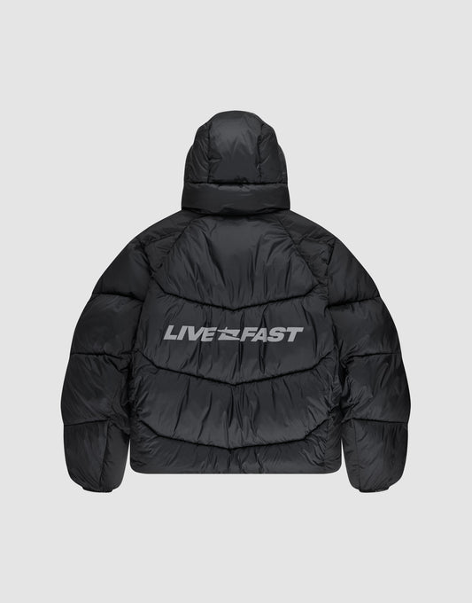 The Live Fast Puffer Jacket by LIVE FAST DIE YOUNG features a black oversize fit, hood, and bold white "LIVE FAST" reflektierender Print across the upper back for standout style.