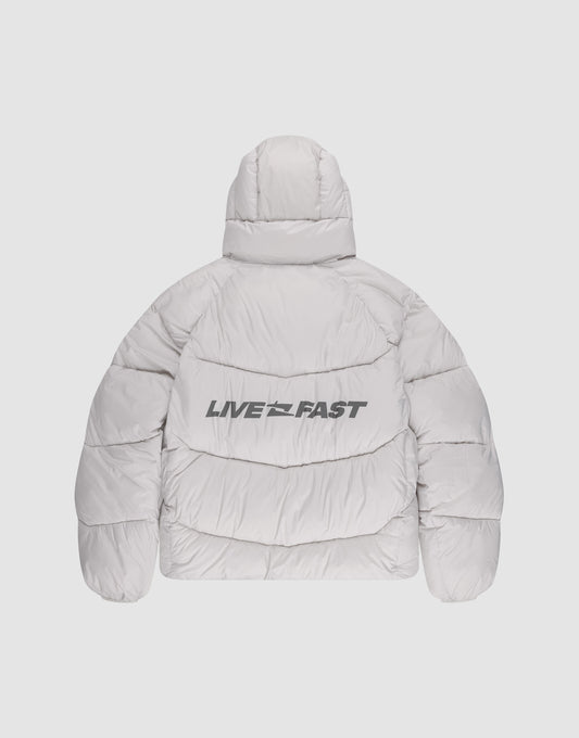 The Live Fast Puffer Jacket by LIVE FAST DIE YOUNG is a light gray, hooded jacket shown from the back with a reflective LIVE FAST print in bold black letters across the back.