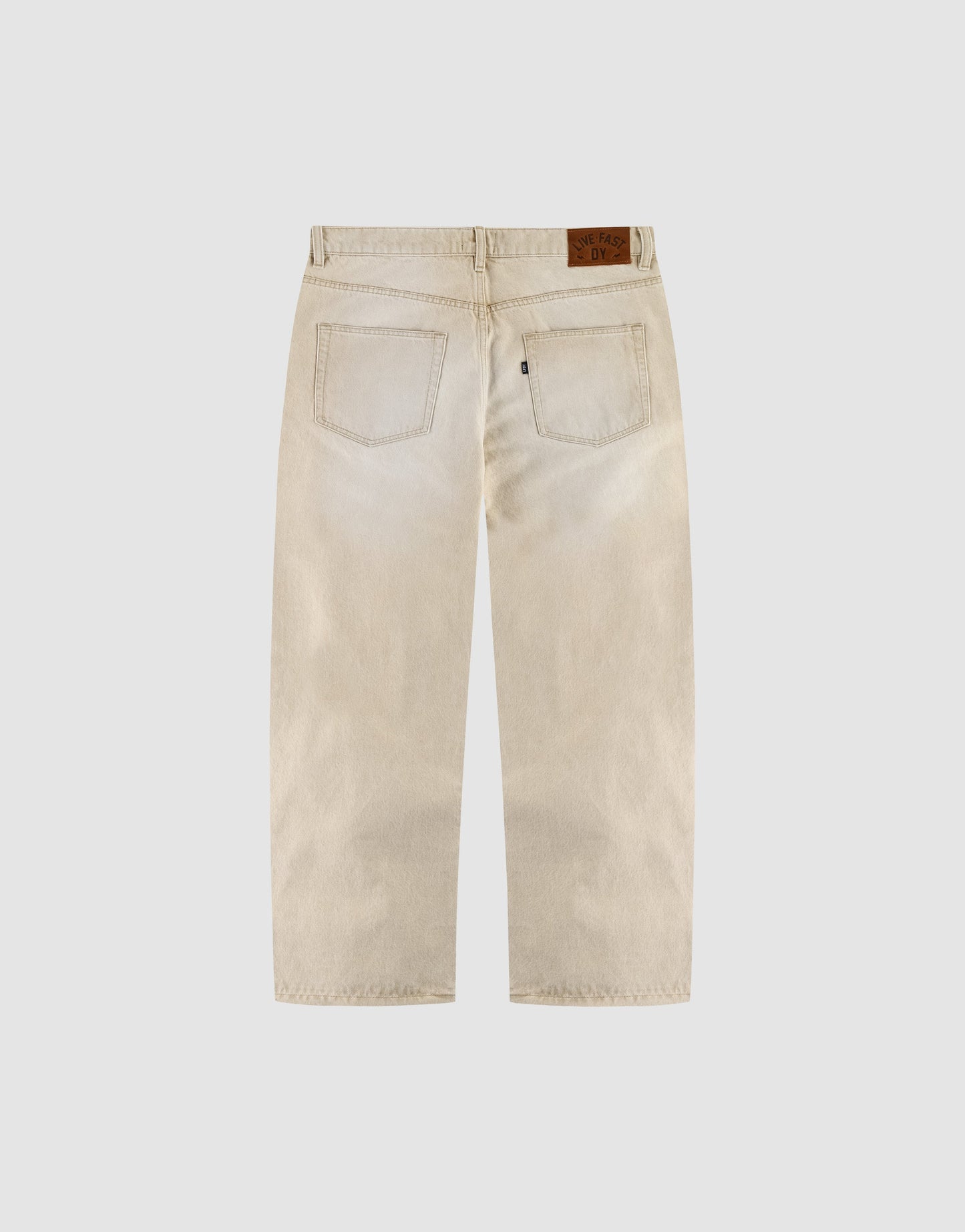 Back view of LIVE FAST DIE YOUNG LFDY Baggy Denim in light beige with wide straight legs, two rear pockets, and a black label on the waistband, shown against a plain white background.