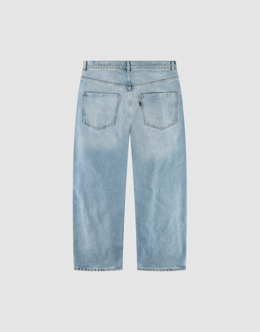 The LFDY Baggy Denim by LIVE FAST DIE YOUNG features a light blue, high-waisted baggy fit with two back pockets, belt loops, and wide straight legs—made from 100% cotton and shown flat on a white background.