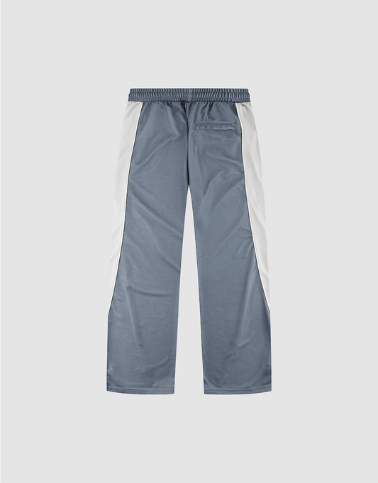 LFDY DY Trackpants by LIVE FAST DIE YOUNG: gray polyester-blend athletic pants with an elastic waistband, white side panels, a single right back pocket, and straight wide-leg fit, shown flat on a light gray background.
