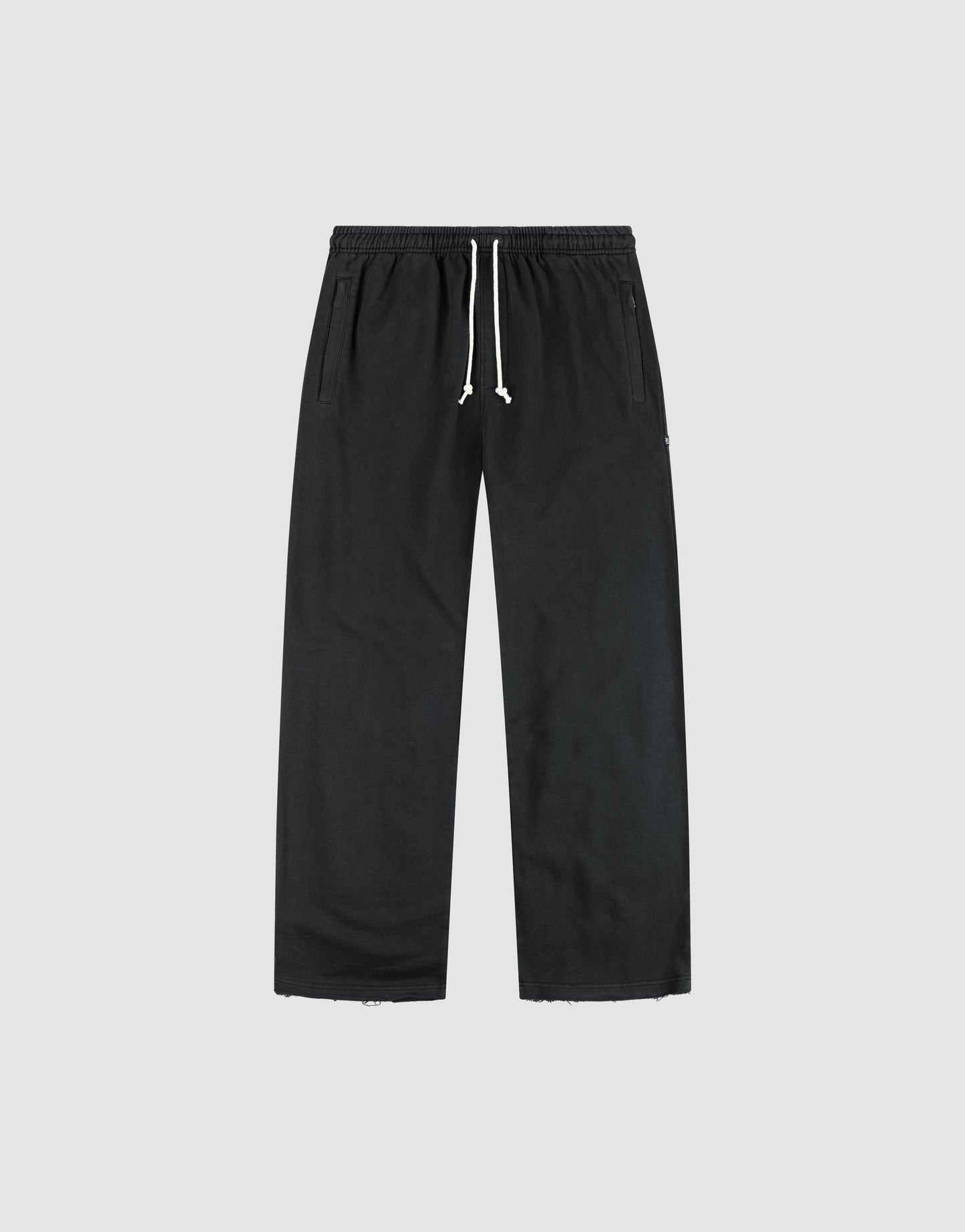 The LFDY Lightweight Jogger by LIVE FAST DIE YOUNG features a wide fit in soft French Terry, with an elastic waistband, white drawstring, and side pockets, shown flat on a light gray background.