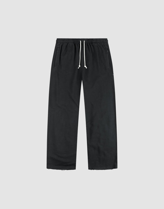 The LFDY Lightweight Jogger by LIVE FAST DIE YOUNG features a wide fit in soft French Terry, with an elastic waistband, white drawstring, and side pockets, shown flat on a light gray background. | plain
