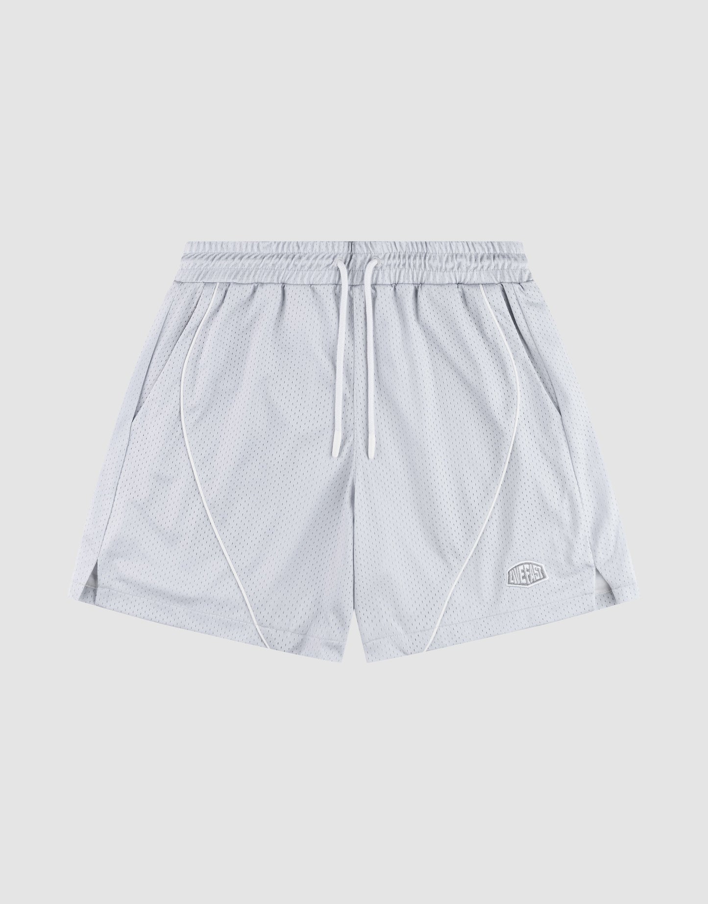 The LFDY Piping Mesh Shorts by LIVE FAST DIE YOUNG feature light gray polyester mesh, an elastic waistband with white drawstring, side pockets, front seam piping, a logo patch on the lower left leg, and a regular fit. Background is plain light gray. | plain