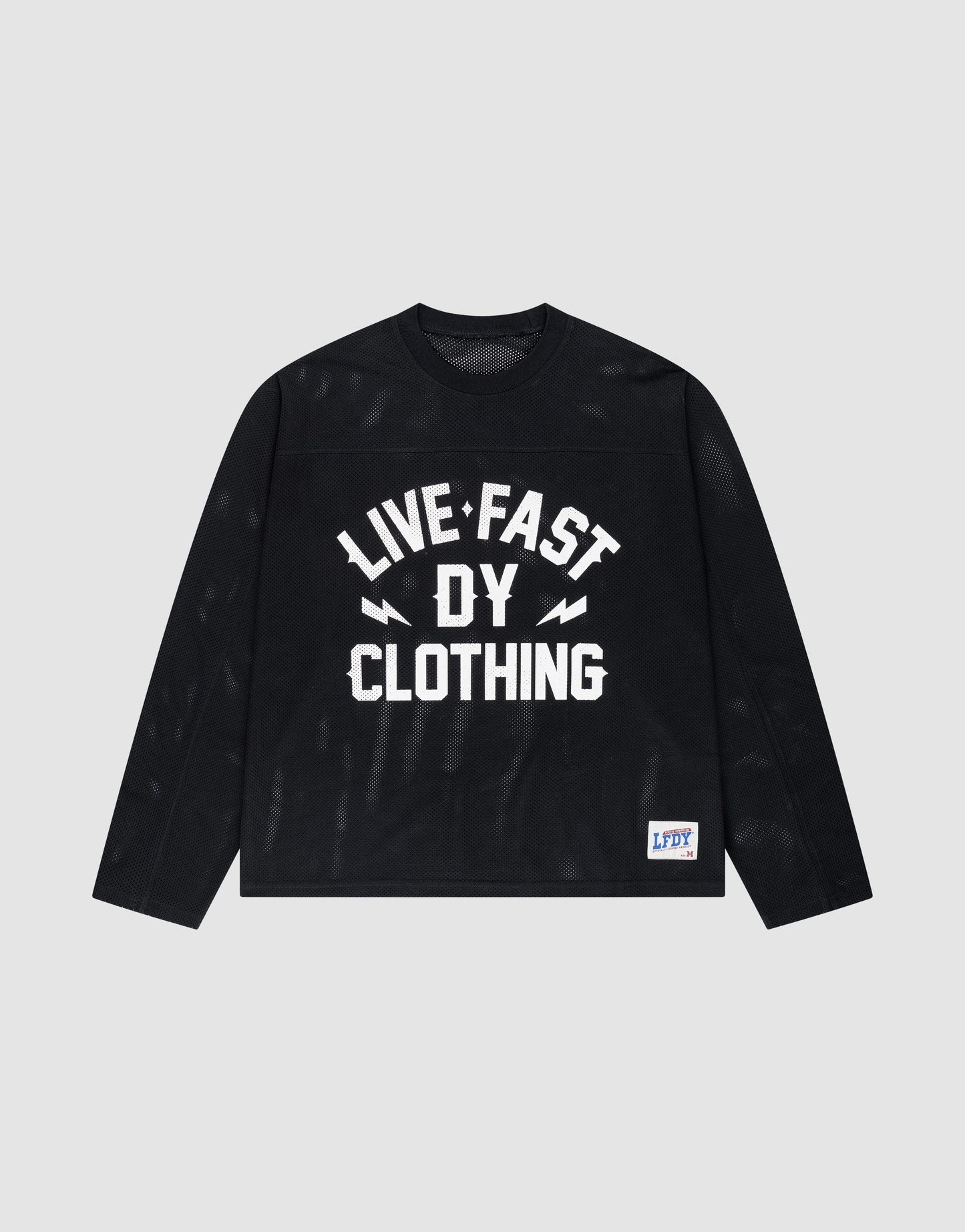The LFDY Flash Jersey by LIVE FAST DIE YOUNG is a black long-sleeve, oversize fit shirt with a bold white "LIVE FAST DY CLOTHING" front print and a small blue-and-white LFDY patch near the hem, shown on a plain background.