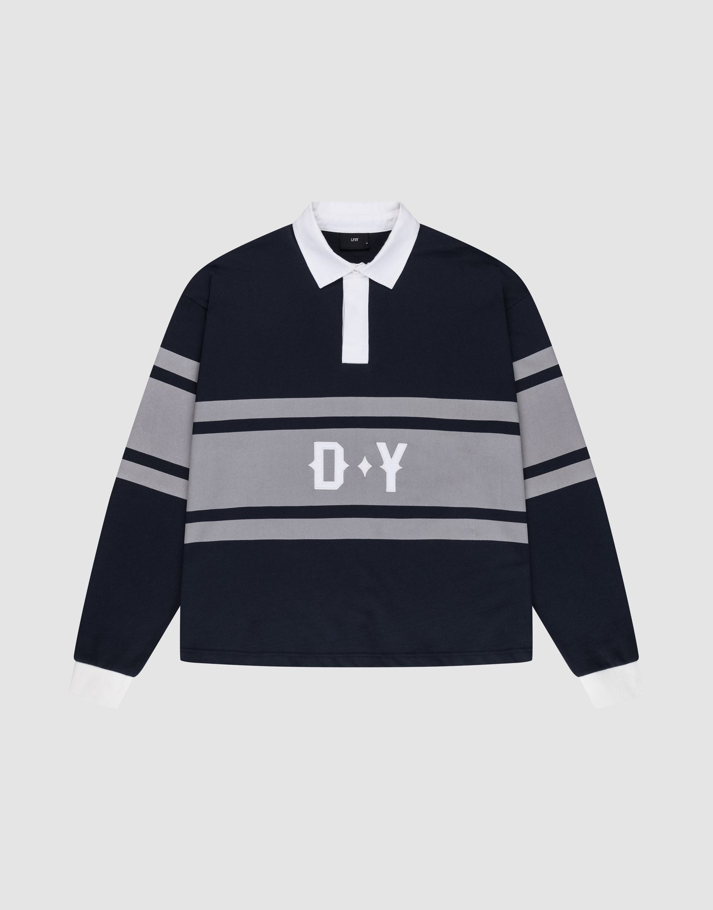 The LFDY Striped Polo by LIVE FAST DIE YOUNG is a navy blue and gray rugby shirt with an oversize fit, white collar and cuffs, horizontal gray stripes, and bold white D Y lettering on the front. Laid flat on a light gray background.