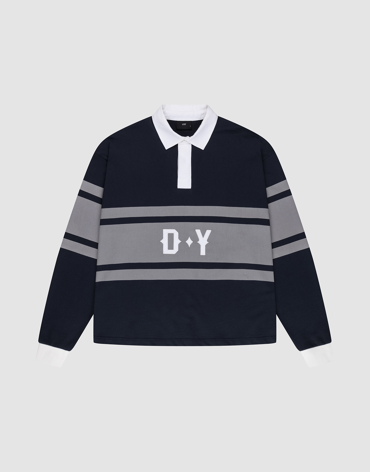 The LFDY Striped Polo by LIVE FAST DIE YOUNG features a navy blue oversize fit, white collar and cuffs, gray stripes across the chest and sleeves, and "D Y" in white on the front. Shirt is laid flat on a light gray background. | plain
