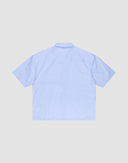 A light blue and white vertically striped LFDY Striped Boxy Shirt by LIVE FAST DIE YOUNG with short sleeves, logo-stitch, oversize fit, shown from the back and laid flat on a plain light gray background.