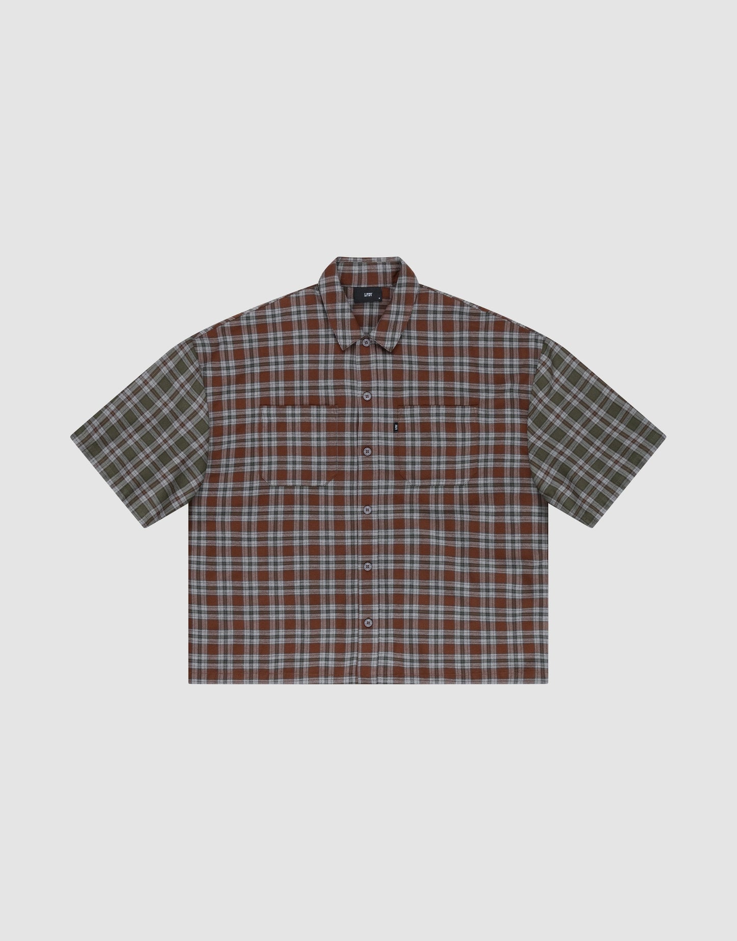 The LFDY Light Flannel by LIVE FAST DIE YOUNG is a short-sleeved, button-up shirt with brown, green, and white plaid, an oversize fit, left chest pocket, and is made from 100% Baumwolle. Shown against a plain light gray background. | plain