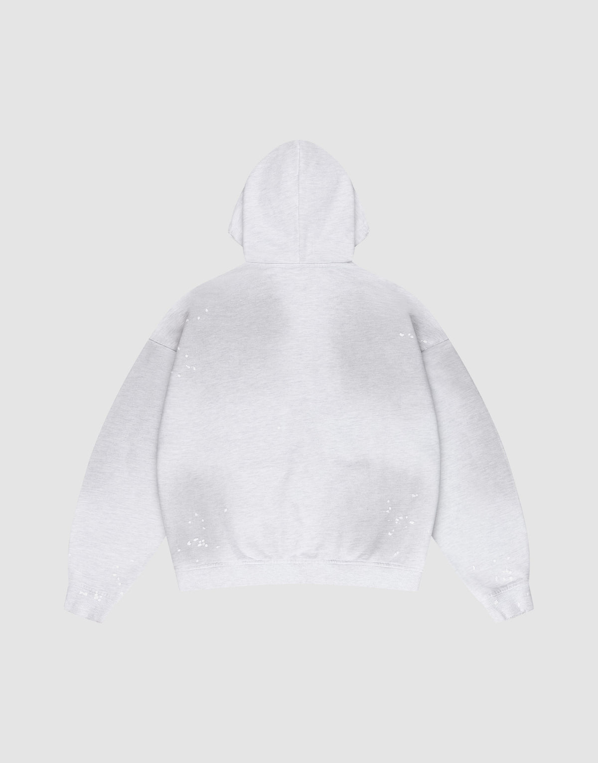 The LIVE FAST DIE YOUNG Live Fast Rivet Hooded Zip in light gray is laid flat, back up, on a matching background. It features an oversize fit and hand-applied spray effect with scattered white specks.