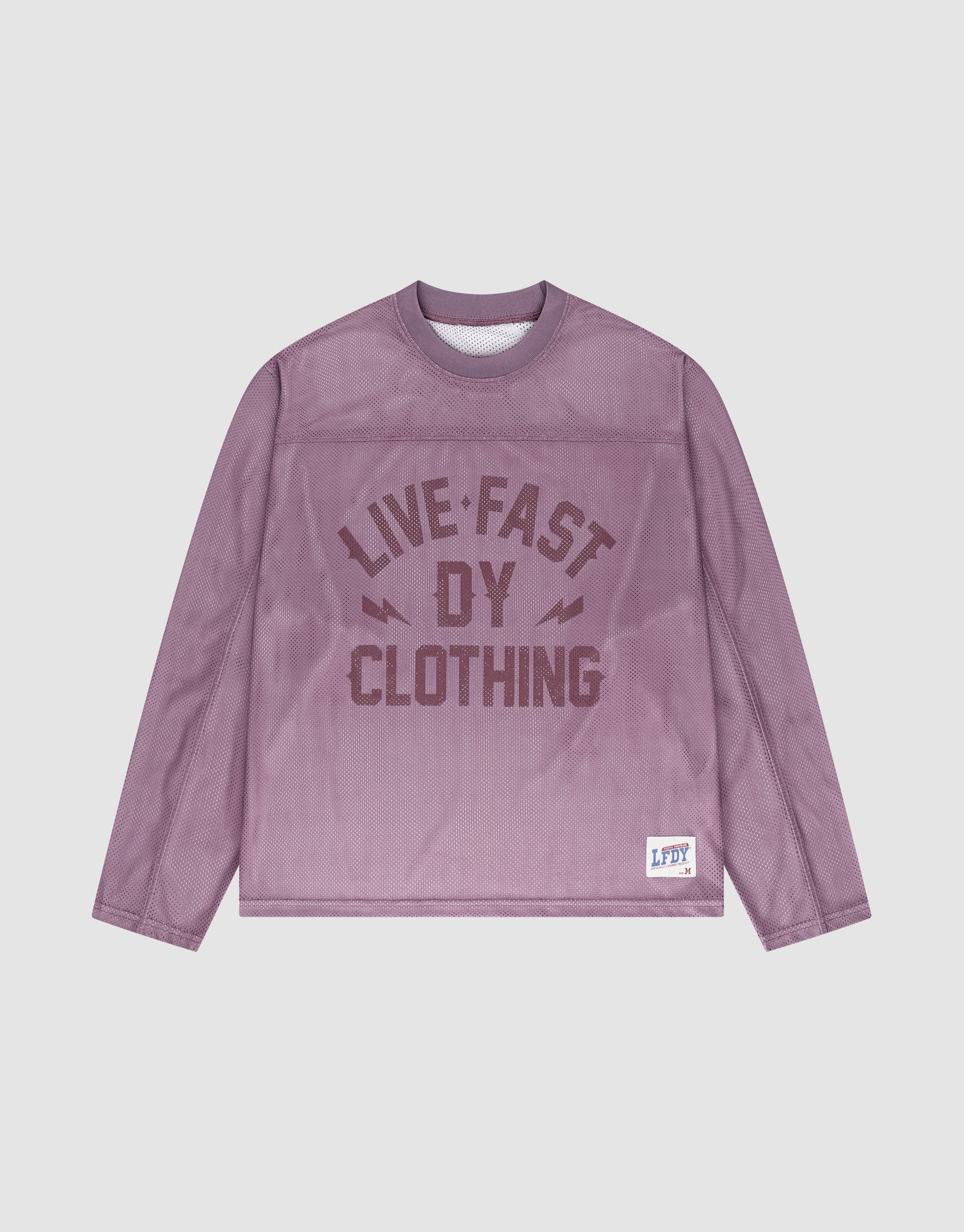 The LFDY Flash Jersey by LIVE FAST DIE YOUNG is a purple mesh, long-sleeve shirt with an oversized fit, bold front branding, and a small LFDY label on the lower left hem.