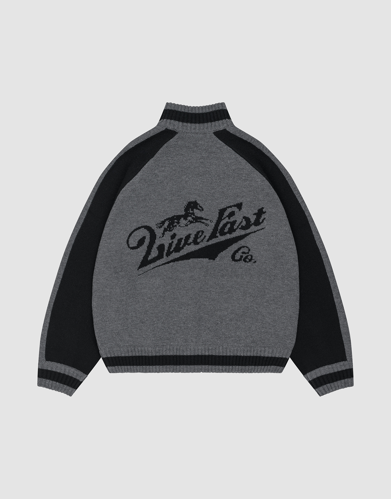 A person wears a gray and black Boxy Knit Zip Jacket by LIVE FAST DIE YOUNG, featuring Raglan sleeves and an oversize fit, with hands in pockets against a light gray background. "Diesel" is embroidered on the chest.