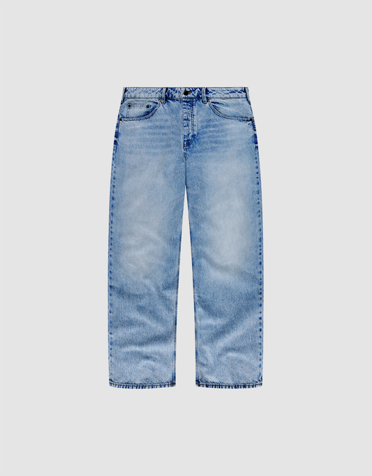 The LFDY Baggy Denim by LIVE FAST DIE YOUNG features light blue, slightly faded, baggy straight legs, five pockets, belt loops, and a button-zip closure. Made from 100% cotton and shown on a plain white background. | plain