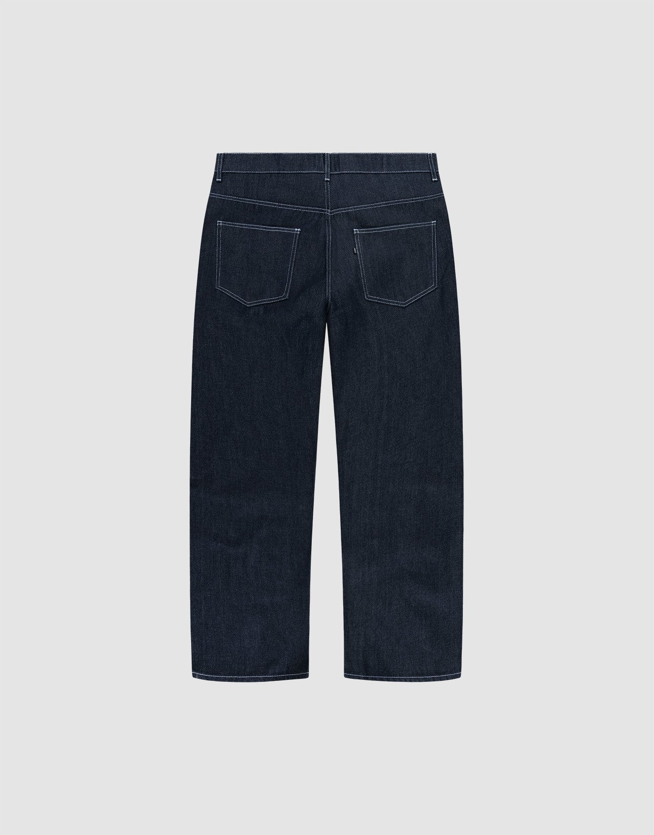 LFDY Baggy Denim by LIVE FAST DIE YOUNG in dark blue raw denim, shown from the back with wide straight legs, white stitching, and two rear pockets. Made from 100% cotton and displayed on a plain light gray background.