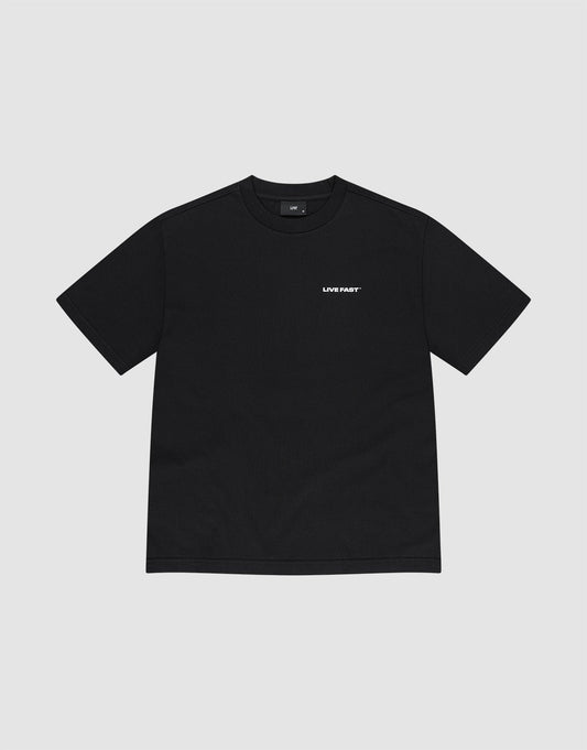 The LFDY Cinema Tee by LIVE FAST DIE YOUNG is a black oversized short-sleeve t-shirt, shown flat on a light gray background. Crafted from premium cotton, it features a small white "LIVE FAST" print on the left chest.