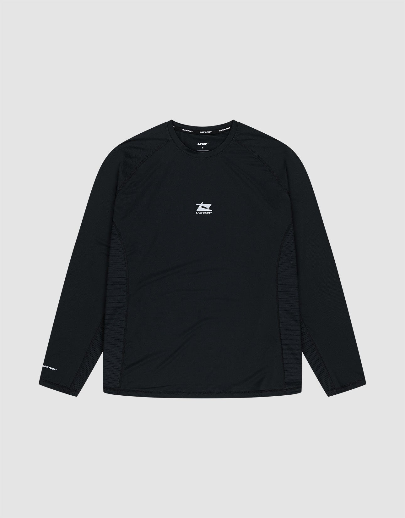The LIVE FAST DIE YOUNG Live Fast Performance Longsleeve is a black slim-fit athletic shirt featuring a small white logo and text on the chest, plus more white text on the left sleeve and a reflective front print, shown on a plain light gray background. | plain