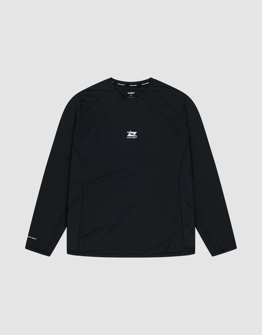 The LIVE FAST DIE YOUNG Live Fast Performance Longsleeve is a black slim-fit athletic shirt featuring a small white logo and text on the chest, plus more white text on the left sleeve and a reflective front print, shown on a plain light gray background. | plain