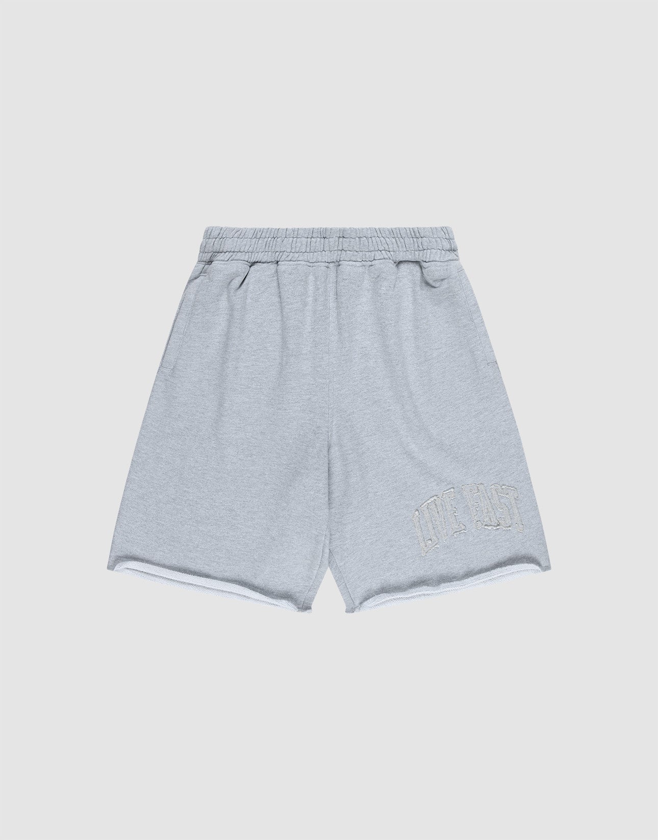 The Ripped College Shorts by LIVE FAST DIE YOUNG feature a light grey color, Elastik-Bund, oversize fit, and subtle "LIVE FAST" embroidery near the bottom left hem, shown against a plain white background.