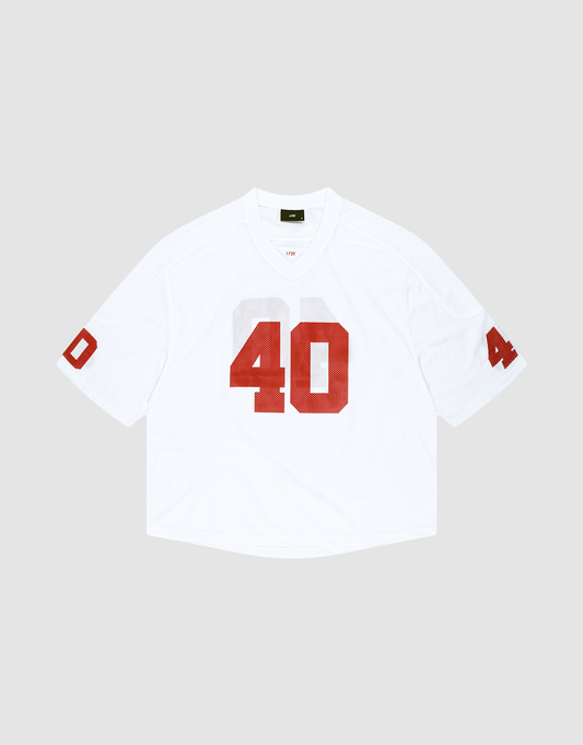 The LFDY Mesh Jersey by LIVE FAST DIE YOUNG is a white polyester football jersey with an oversize fit, short sleeves, and bold red number 40 on the front and sleeves. It features a V-neck collar and is shown on a light gray background. | plain