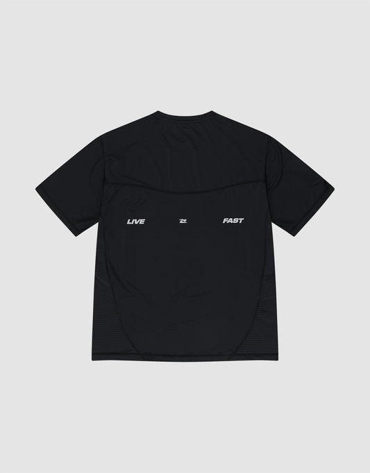 A black Live Fast Performance Tee by LIVE FAST DIE YOUNG, slim fit and short-sleeve, made of Nylon Spandex, with "LIVE" and "FAST" in white reflective print spaced across the upper back.