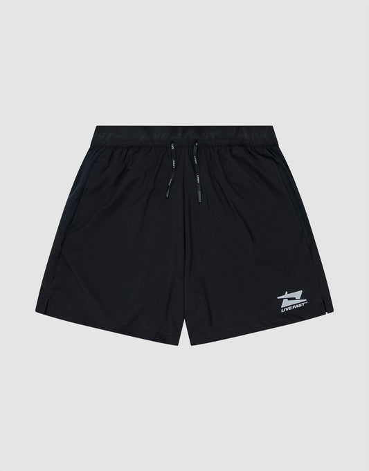The LIVE FAST DIE YOUNG Live Fast Performance Shorts feature a black design with an elastic waistband, drawstring, and small white reflective logo near the left hem. Shown on a light gray background. Regular Fit offers all-day comfort.| plain